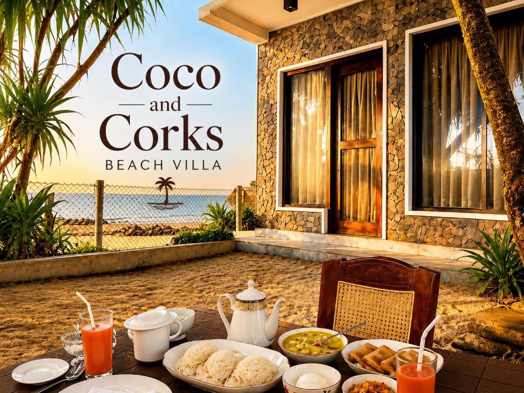 a table with food on it in front of a beach villa at Coco and Corks Villa in Negombo