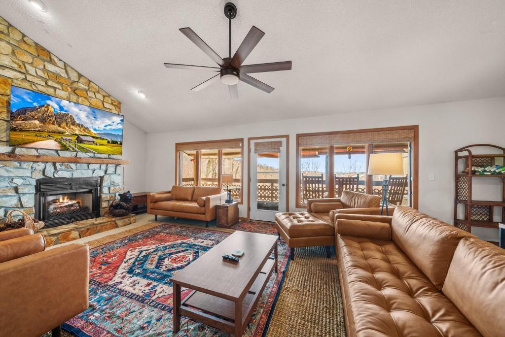 a living room with a couch and a fireplace at Oma's Beech House in Beech Mountain