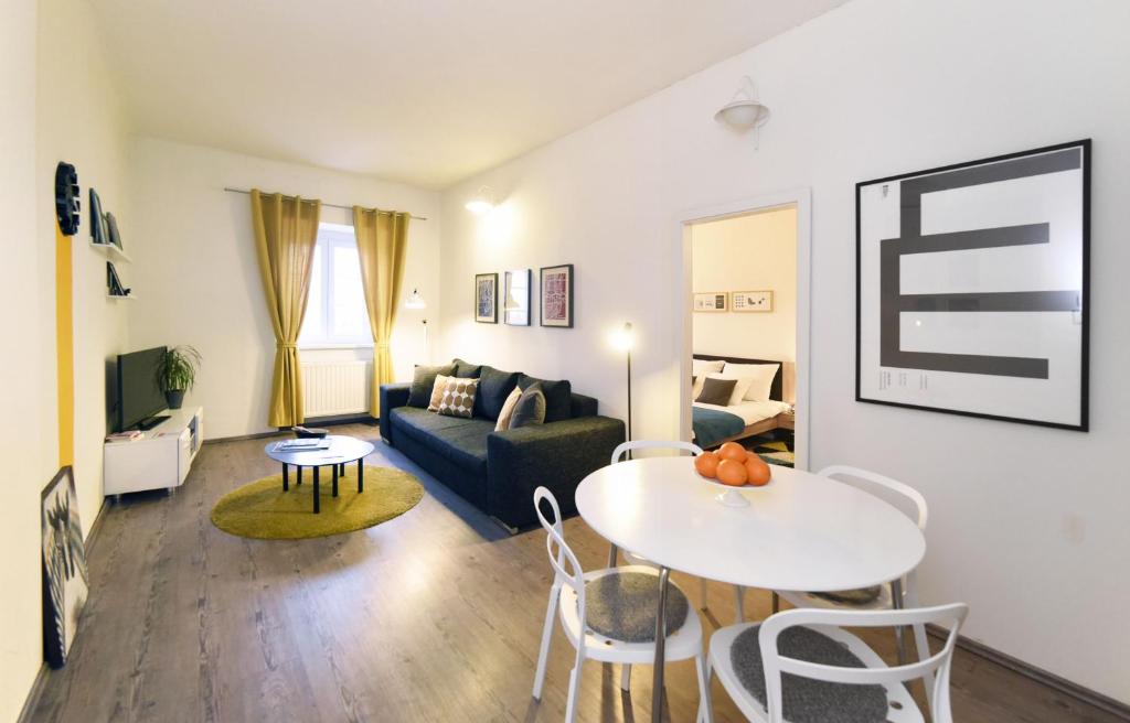a living room with a couch and a table at Block Apartment in Zagreb