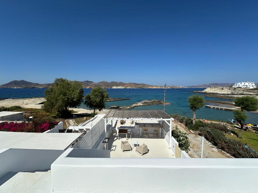 a view of the water from the roof of a house at Pelekouda Coastal Apartments in Pollonia