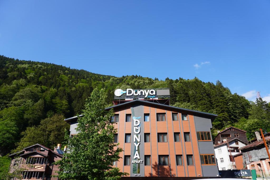 a building with a sign on top of it at Dünya Apart in Çaykara