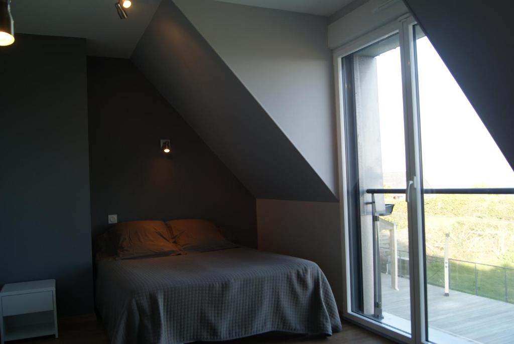 Postel nebo postele na pokoji v ubytování Residence Kersaliou