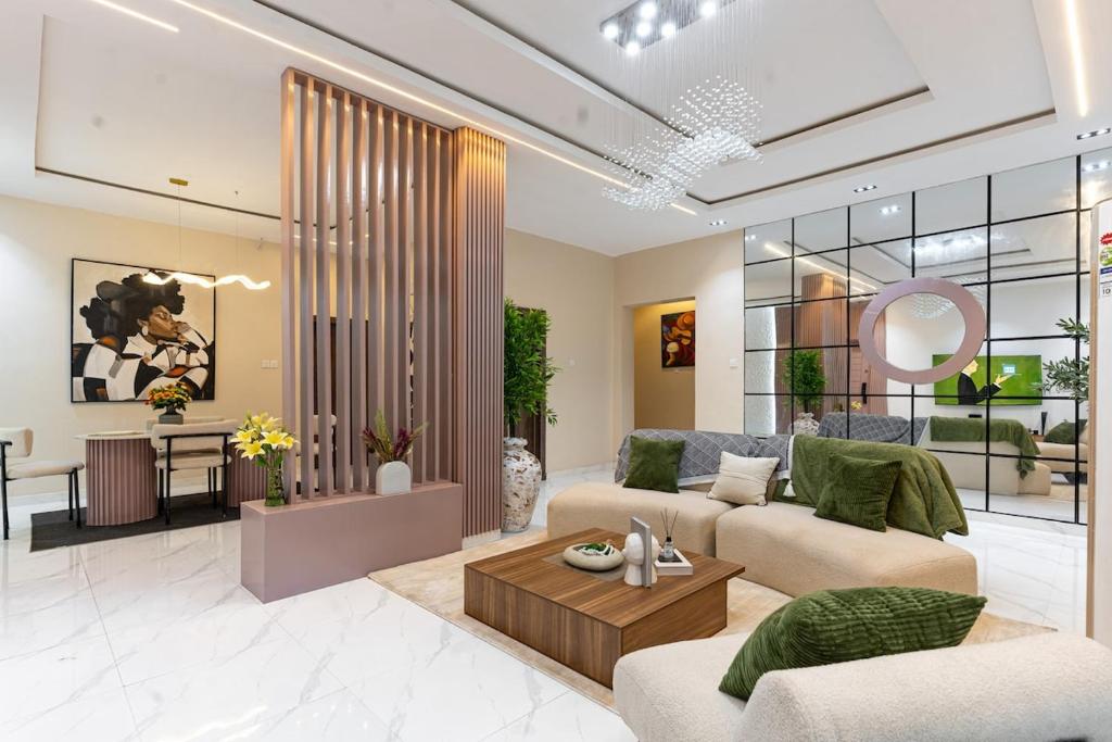 a living room with a couch and a table at Mirage in Lekki