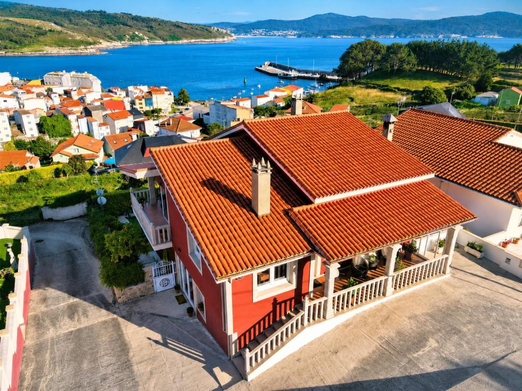 an aerial view of a house with red roofs at Hospedium Galitrips Vila Maruja Corme in Corme-Puerto
