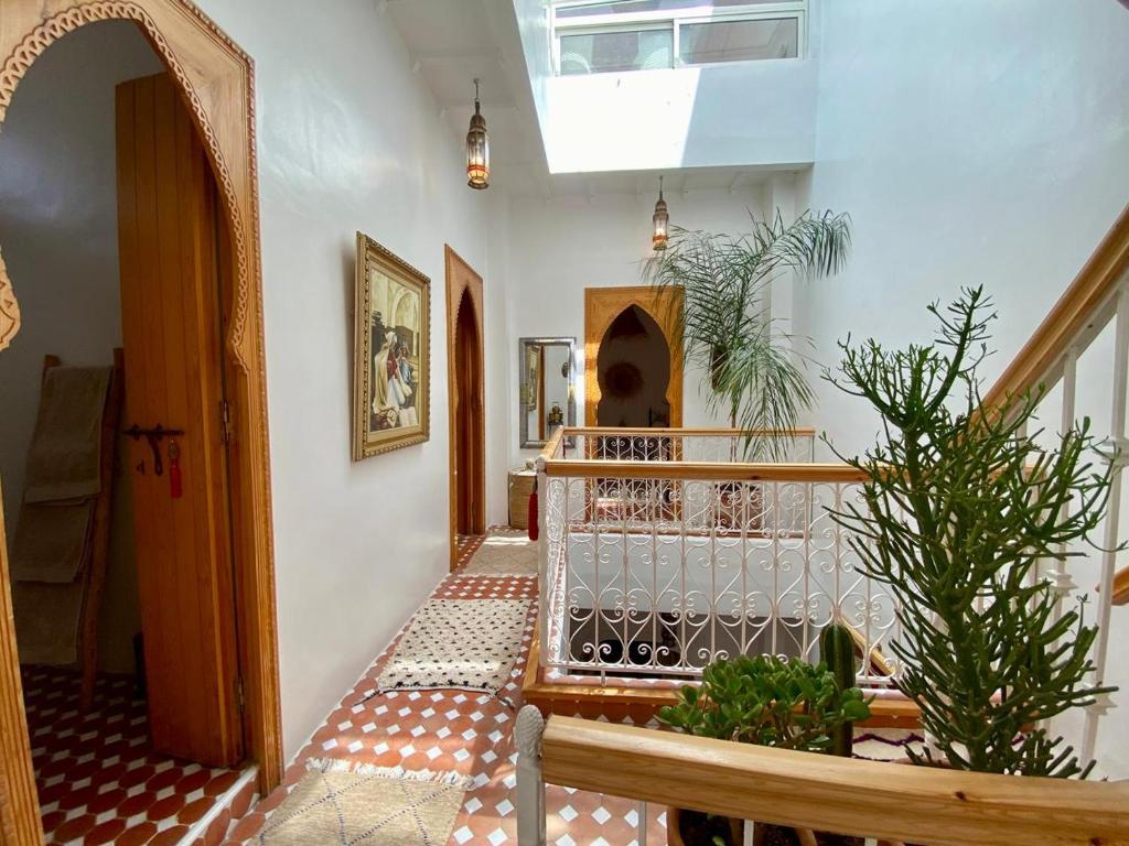 a hallway of a house with a stairway with a staircase at Dar Dada Riad climatisé à votre disposition dans sa totalité et de façon exclusive in Safi