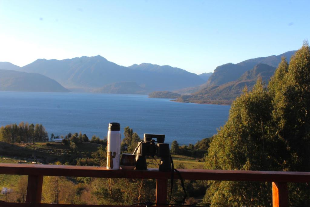 a view of a lake with mountains in the background at El Tilo Cabin - Hot Tub & Lake Ranco Views in Lago Ranco