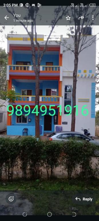 a building with a car parked in front of it at Vibheeshan Villa in Yelagiri