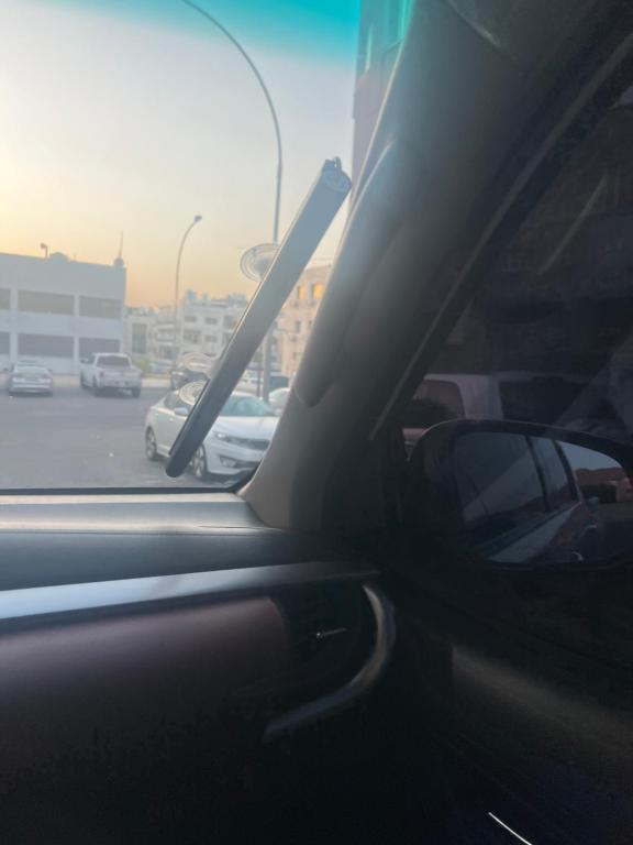 a view from a car window of a parking lot at Lora luxury in Al Mudawwarah