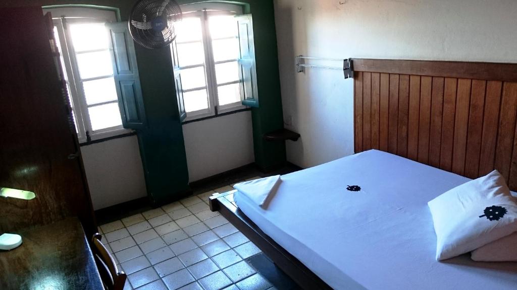 Postel nebo postele na pokoji v ubytování Laranjeiras Hostel