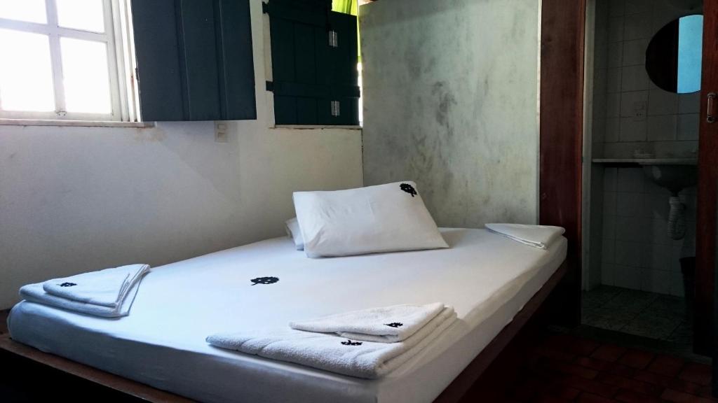 Postel nebo postele na pokoji v ubytování Laranjeiras Hostel