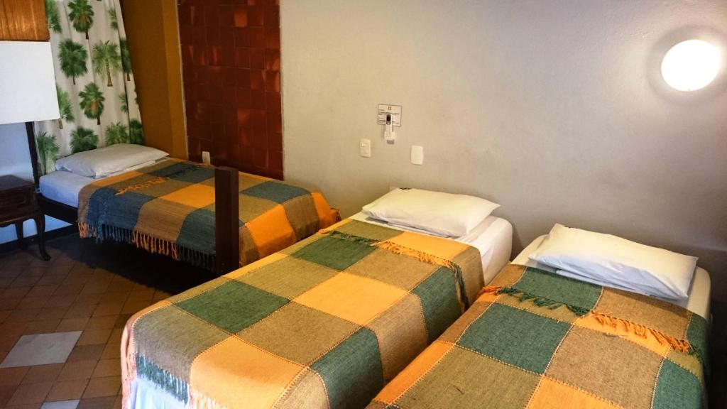 Postel nebo postele na pokoji v ubytování Laranjeiras Hostel