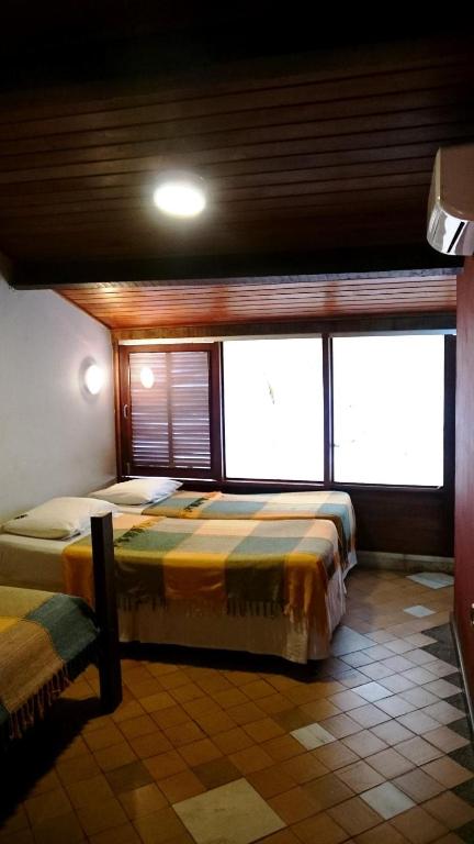 Postel nebo postele na pokoji v ubytování Laranjeiras Hostel