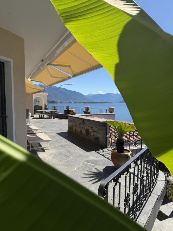 a balcony with a view of the water from a house at Casa Chatelain in Ronco sopra Ascona