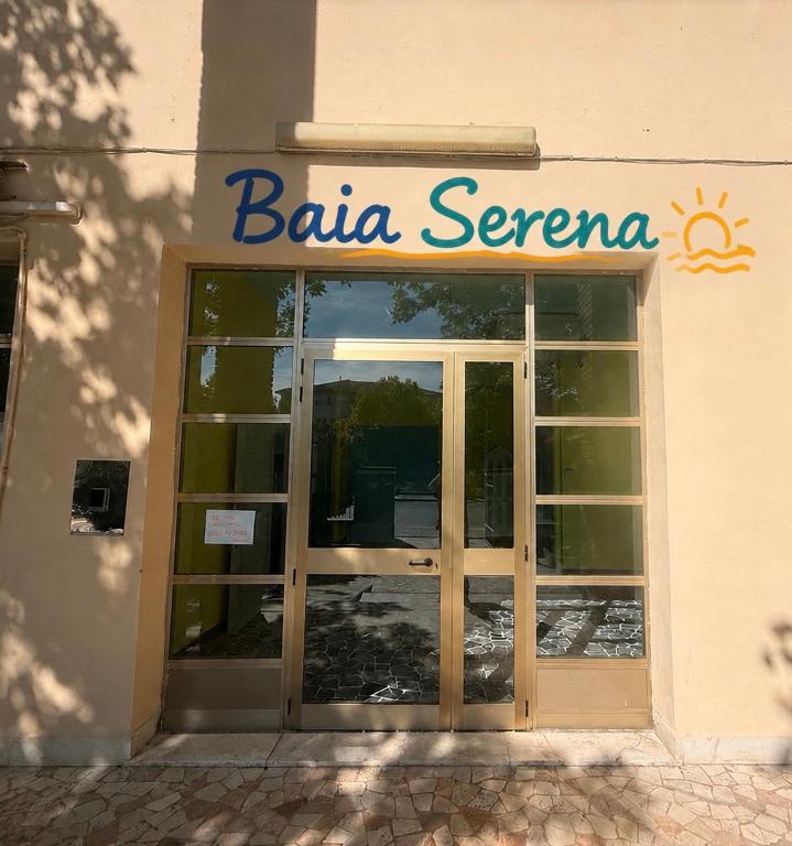 a building with a sign on the front of it at Campus Baia Serena in Bellaria-Igea Marina