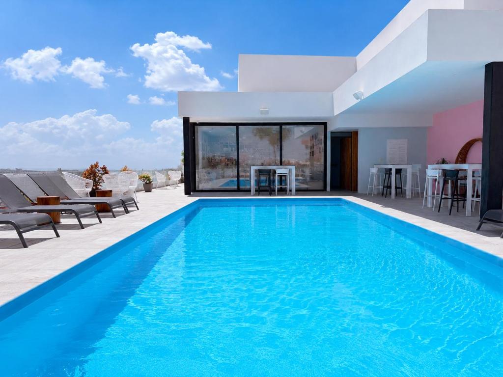 a swimming pool in a villa with a view at CALIXTA Hotel in Playa del Carmen