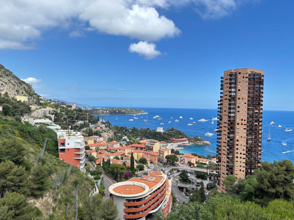 a city on a hill next to the ocean at New,mountain & sea view 3 guests with private Garage in Beausoleil