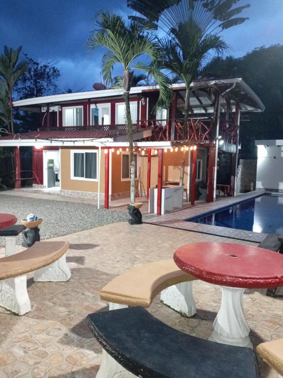a villa with a swimming pool and a resort at PuertoViejo in Puerto Viejo