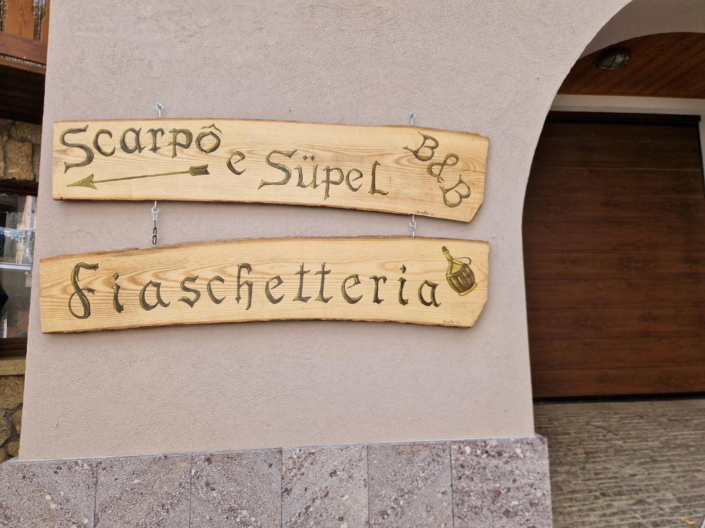 a sign on the side of a building at B&B Scarpo & Supel in Nona