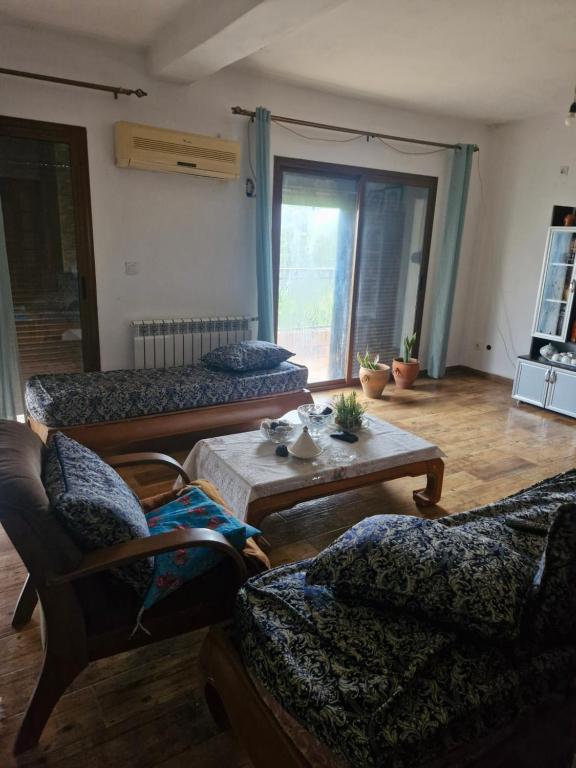 a living room with couches and a coffee table at Maison in Tizi Ouzou