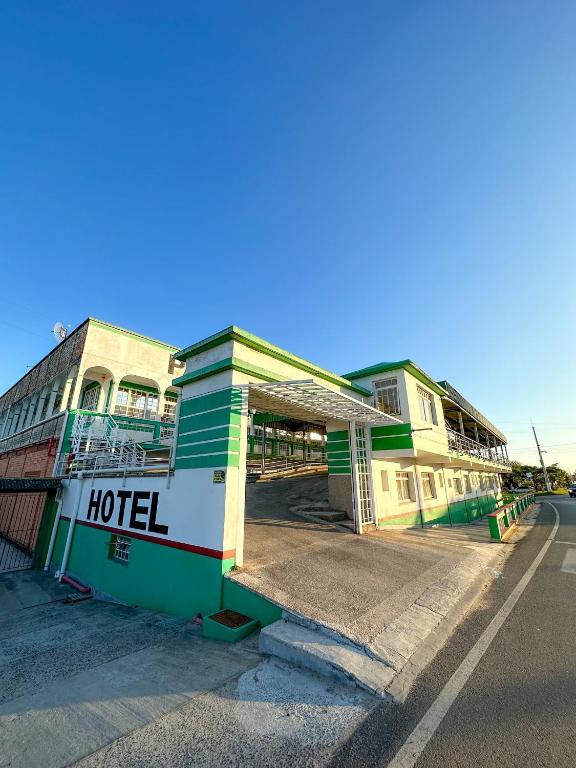 a building with a hotel on the side of the street at Palmares Hotel in Palmares do Sul