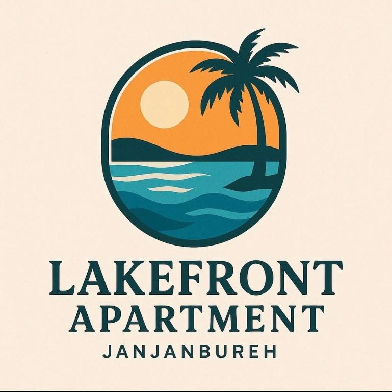 a palm tree and the ocean with the sunset at Lake Front Apartment in Georgetown