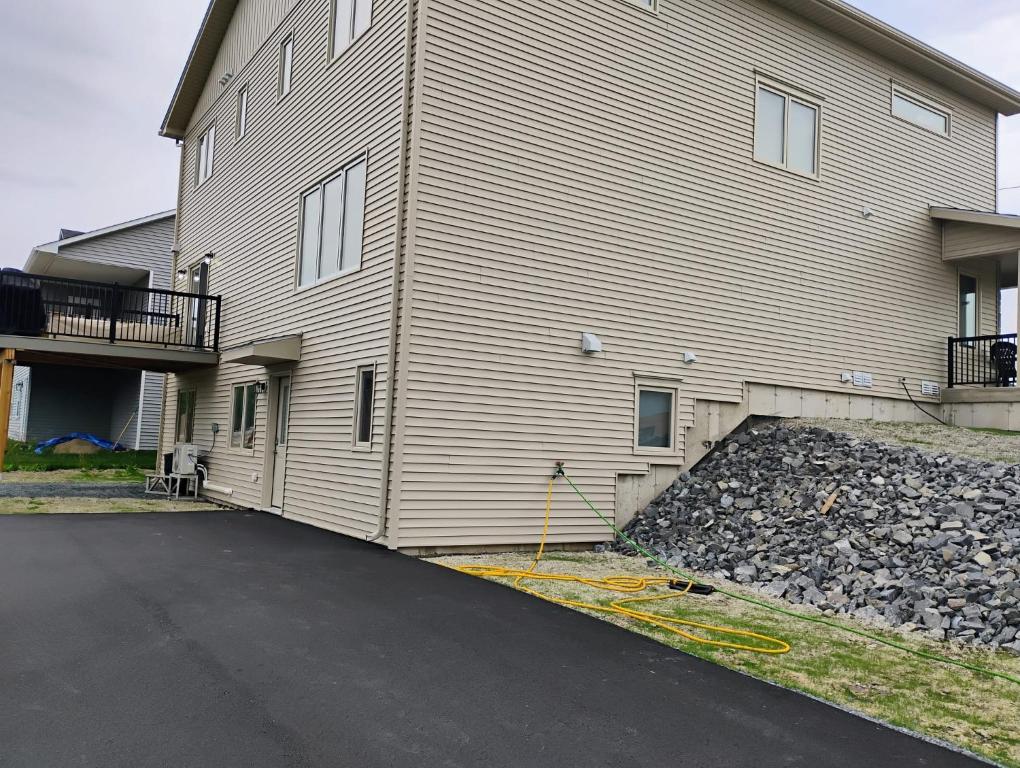 a large building with a driveway in front of it at Apartment in Fredericton in Fredericton