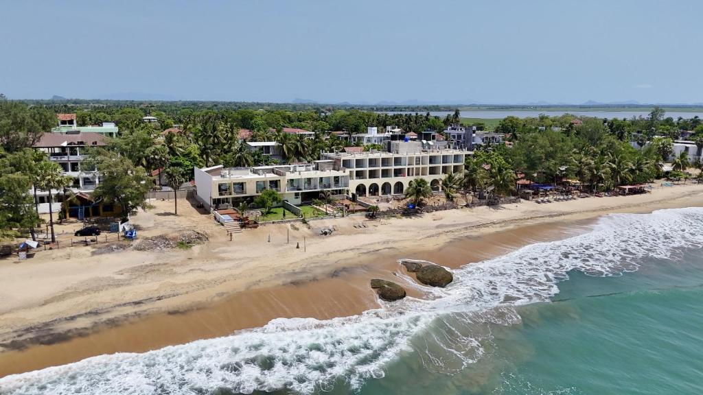 an aerial view of a resort and the beach at Hotel Beach Castle in Arugam Bay