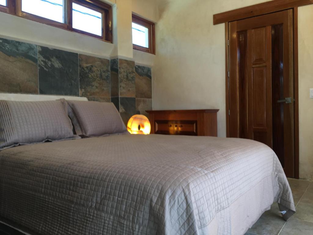 Postel nebo postele na pokoji v ubytování Hotel Casa Maya Calakmul