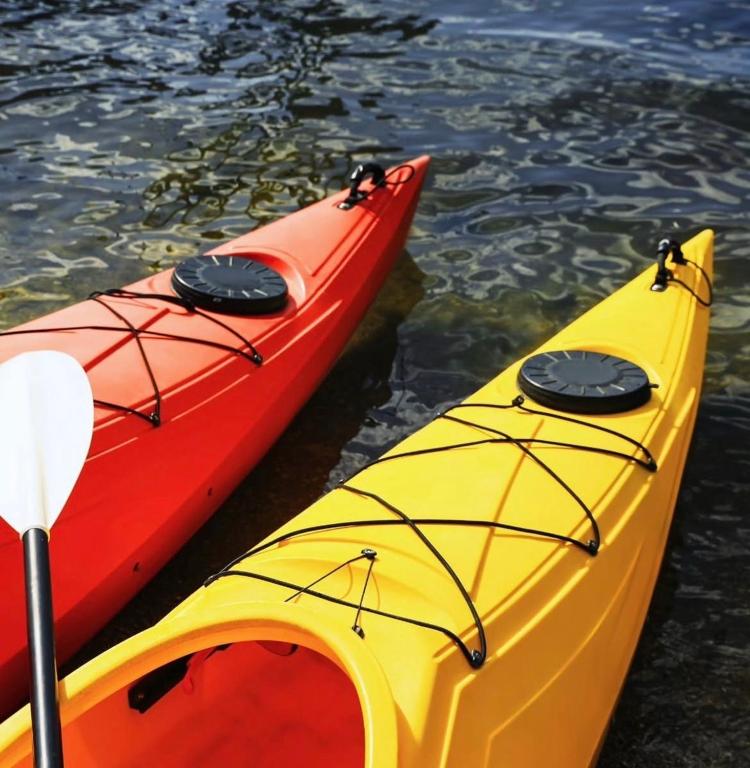 three kayaks sitting next to each other in the water at The Sailor beach House Just 35 Minutes from Panama City! in Vacamonte