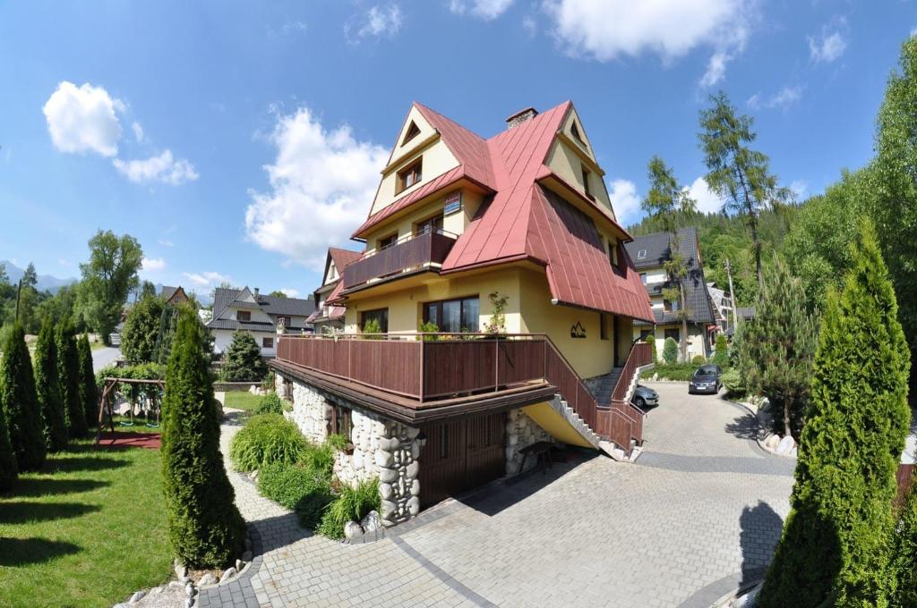 a large house with a red roof at Willa Ewelinka in Zakopane