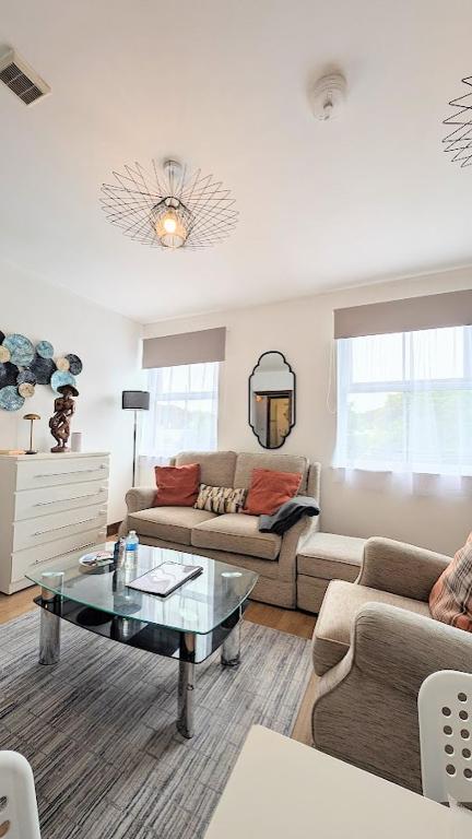 a living room with two couches and a coffee table at CJ Maison - "Spacious Family Friendly 2-Bedroom Apartment in the City Centre with free on-site parking, free Wi-Fi" in Southampton