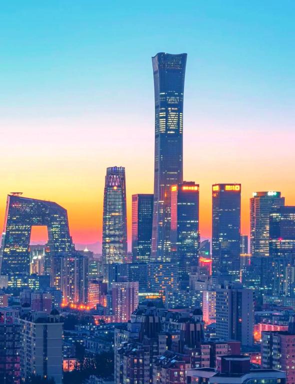 a view of a city skyline at sunset at Atour S Hotel Zuojiazhuang Subway Station Dongzhimen Beijing in Beijing