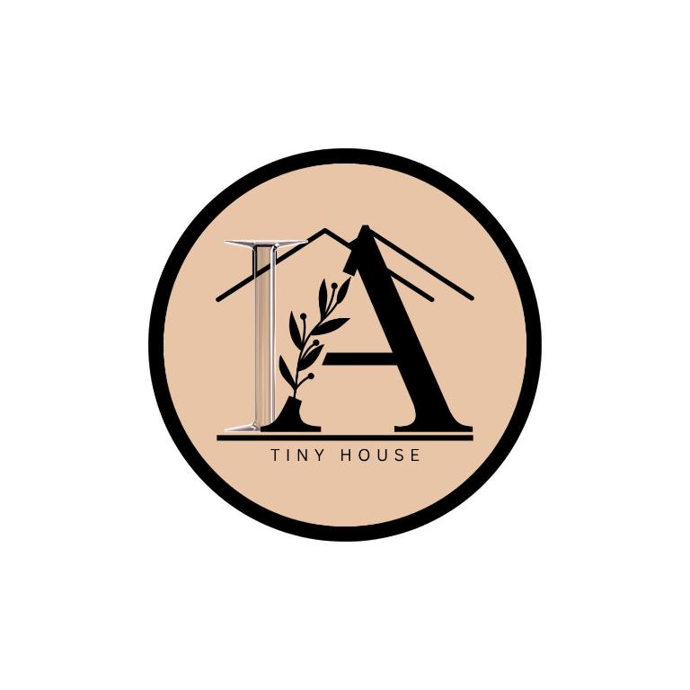 a monogram with a house and a plant in the middle at IA Tiny House 2 in Dungun