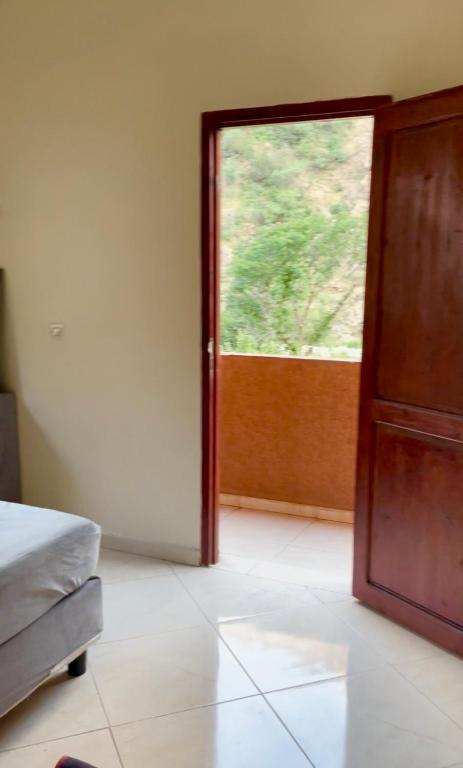 a room with an open door with a window at DAR LAHCEN - Terrace & Mountain View in Ourika