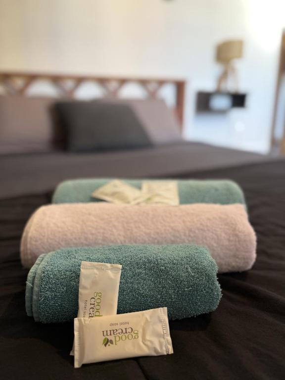 two towels are sitting on top of a bed at Güemes Hostel Cordoba in Córdoba