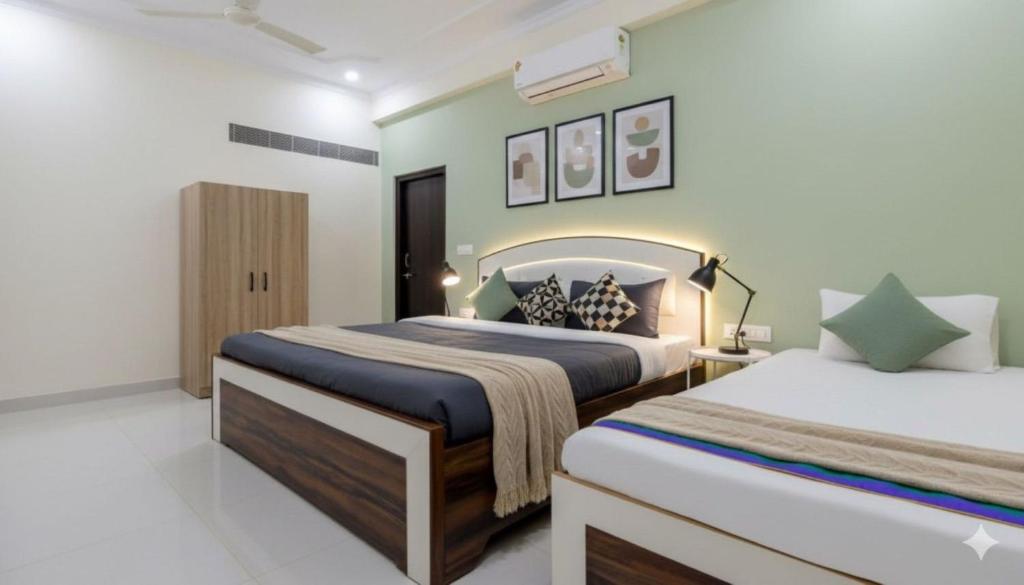 a bedroom with two beds in a room at Hotel The Luxury F S Bliss Most Premium Rooms NearTaj Mahal !!! Best Stay In Agra in Agra
