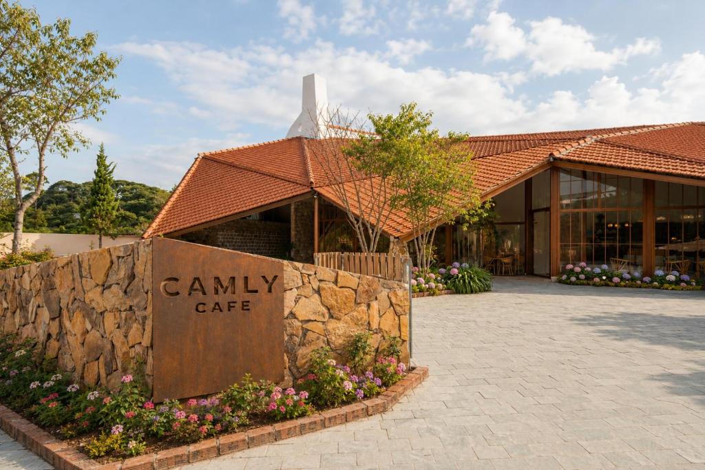 a building with a canyon cafe sign in front of it at Camly the Boutique in Da Lat