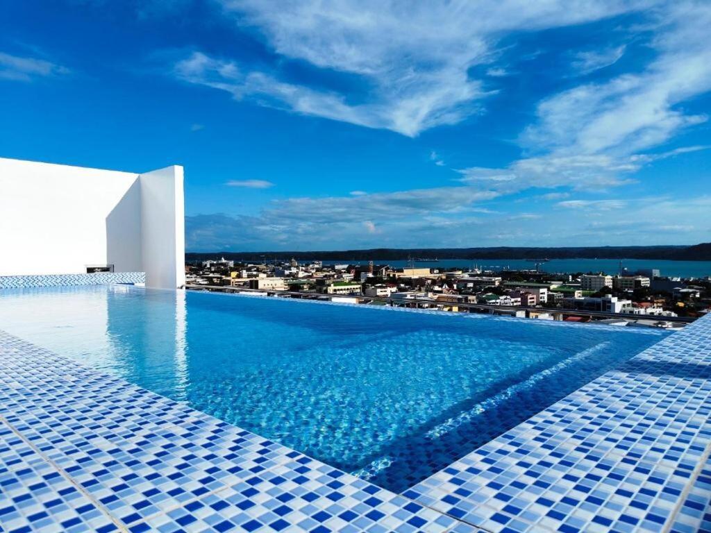a swimming pool with a view of a city at California style Resident in Iloilo City