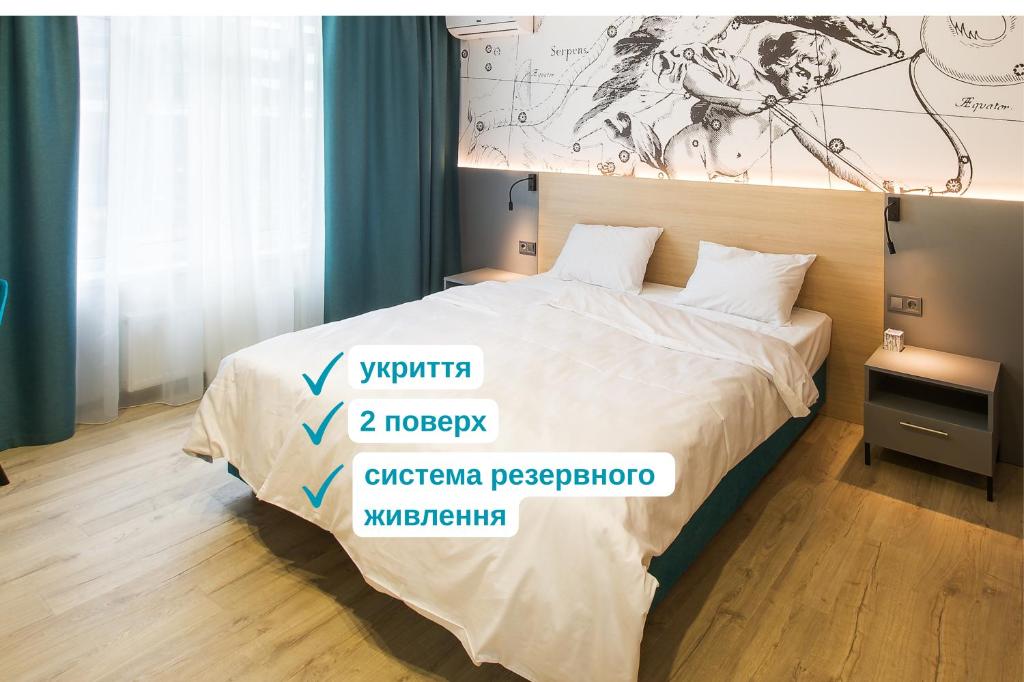 a bedroom with a bed with descriptions on it at ORION apartments in Kyiv