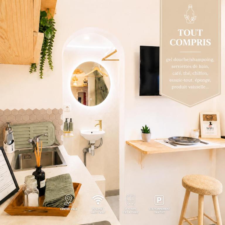 a kitchen with a sink and a counter with a mirror at Le Balinais - Esprit Bali, Centre-ville & Unique in Saint-Brieuc