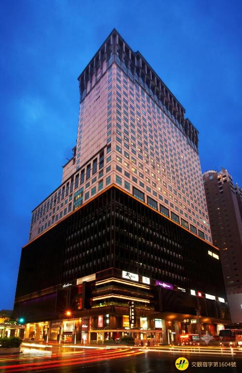 a tall building with a lot of windows at The Splendor Hotel Taichung in Taichung