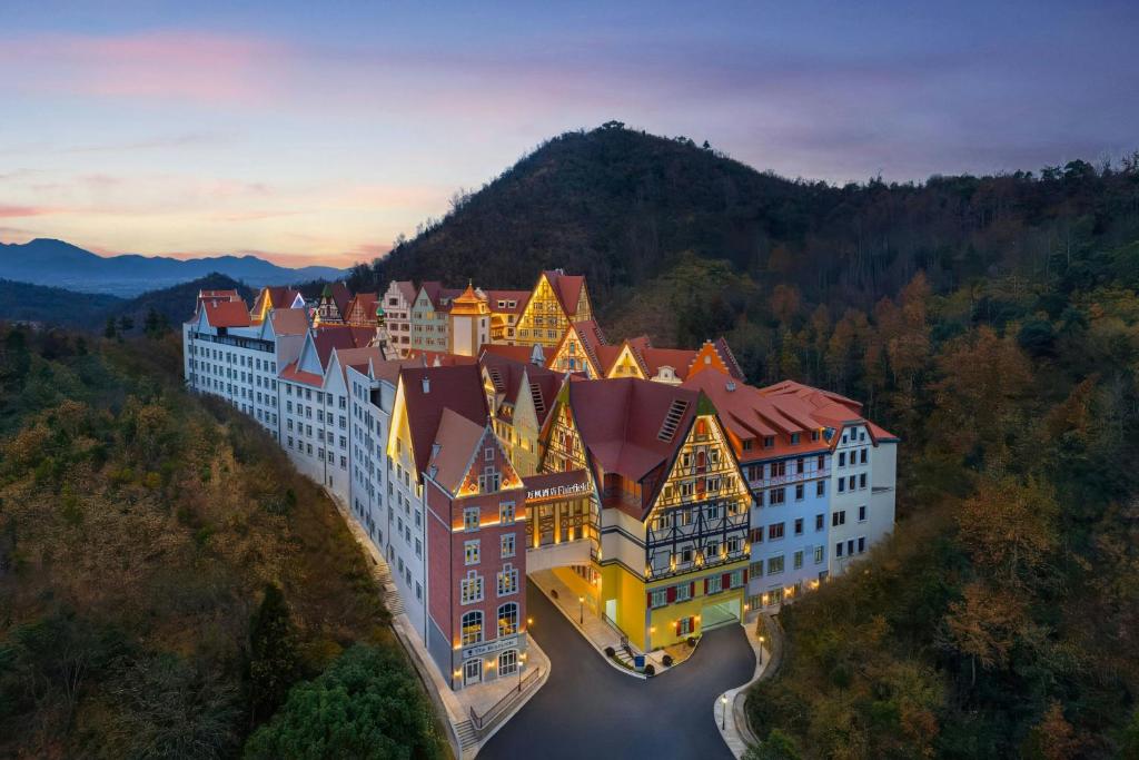 an aerial view of a building with a river at Fairfield by Marriott Hengdian in Dongyang