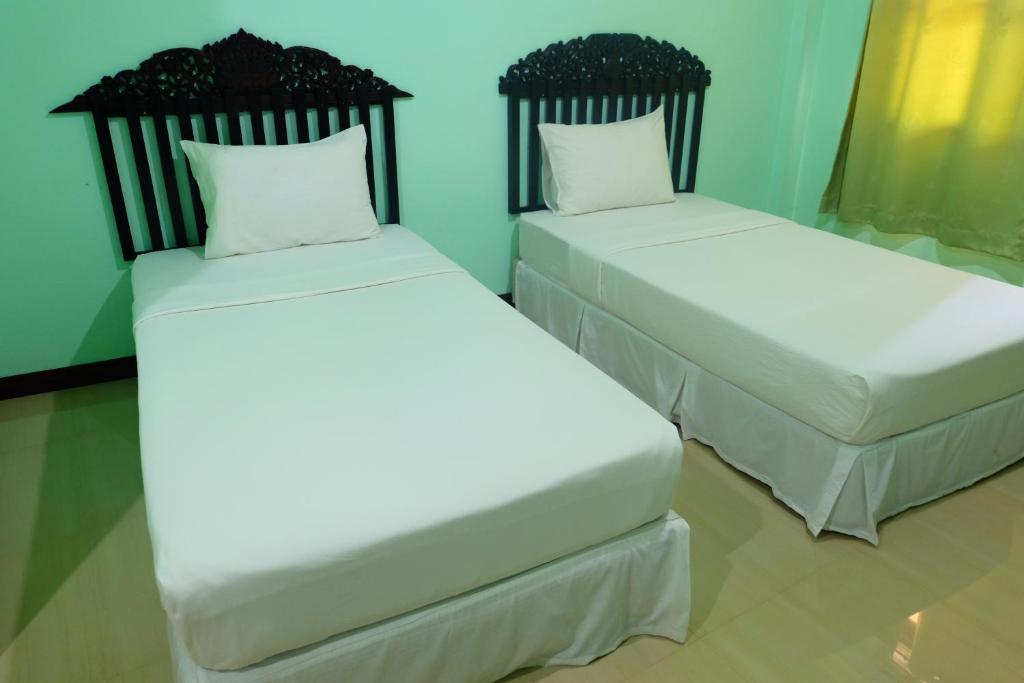 Postel nebo postele na pokoji v ubytování J-Safe Guesthouse