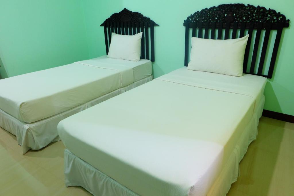 Postel nebo postele na pokoji v ubytování J-Safe Guesthouse