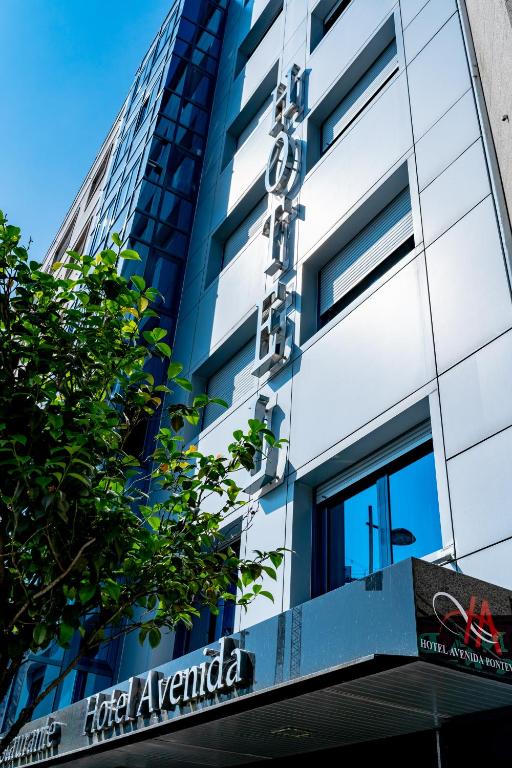 a building with a for aarantica sign on it at Hotel SPA GBC Avenida Pontevedra in Pontevedra