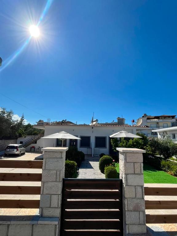 a house with a staircase in front of it at Vila F&M ksamil in Ksamil