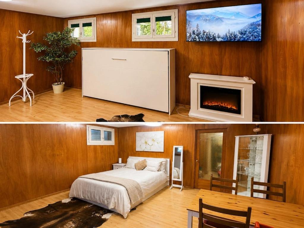 a bedroom with a bed and a fireplace at The Swiss Paradise 3 Cozy Mountain Studio in Wirzweli