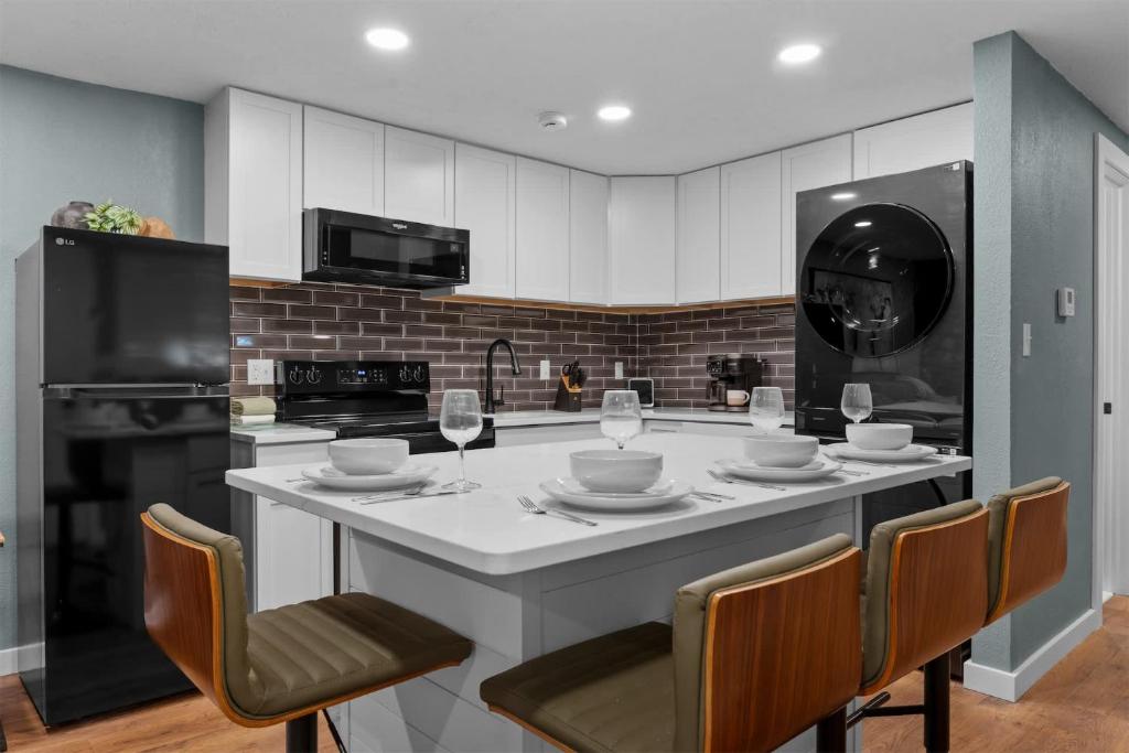 a kitchen with a large island with a table with chairs at Ozark Skyline Retreat in Branson West