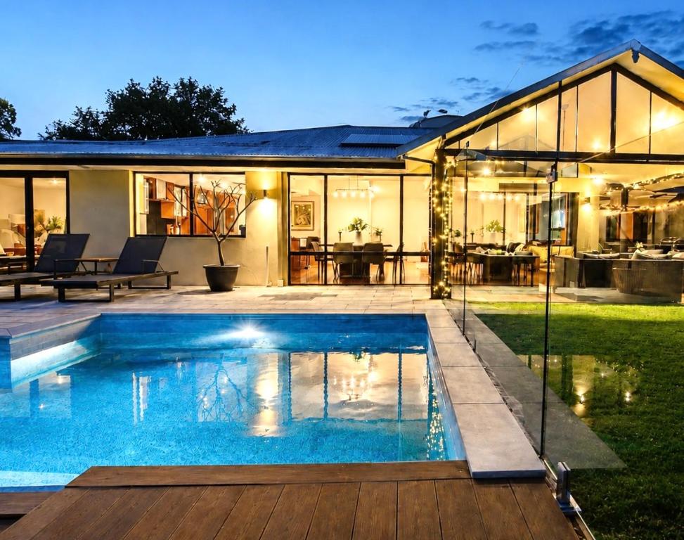 a swimming pool in the backyard of a house at Zig Zag Retreat - Hilltop Home With Stunning Views in Perth