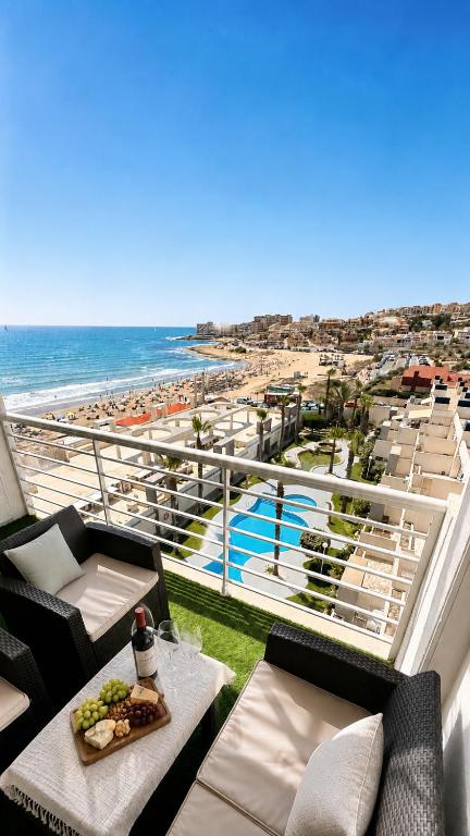 a balcony with a view of a beach and the ocean at Torrevieja - La Mata Beach First Line New Apartments 2024r in La Mata